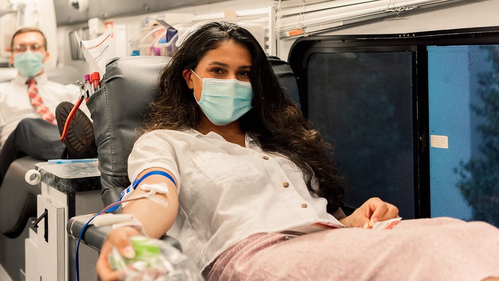 Female student donating blood