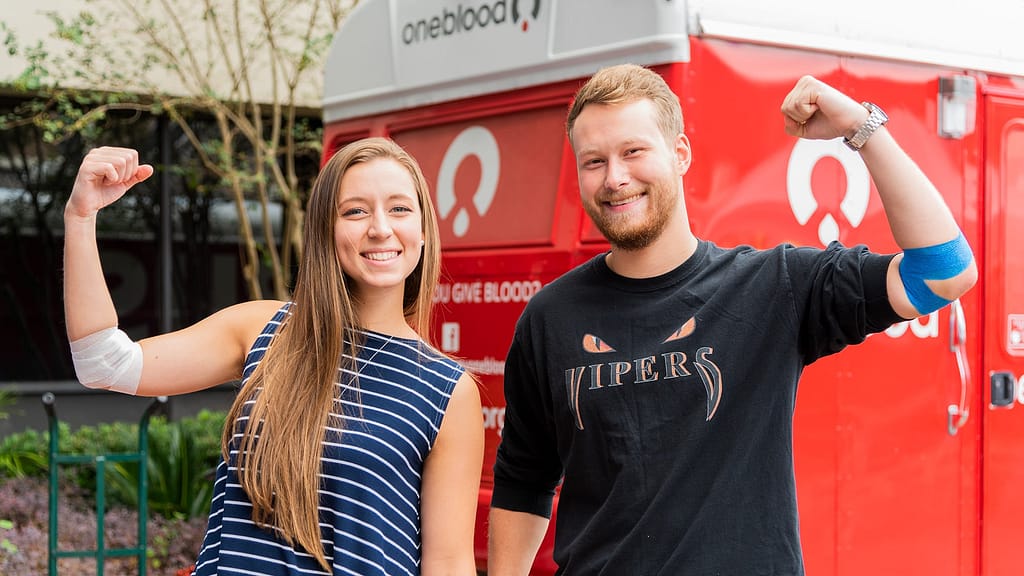 Students outside blood drive van