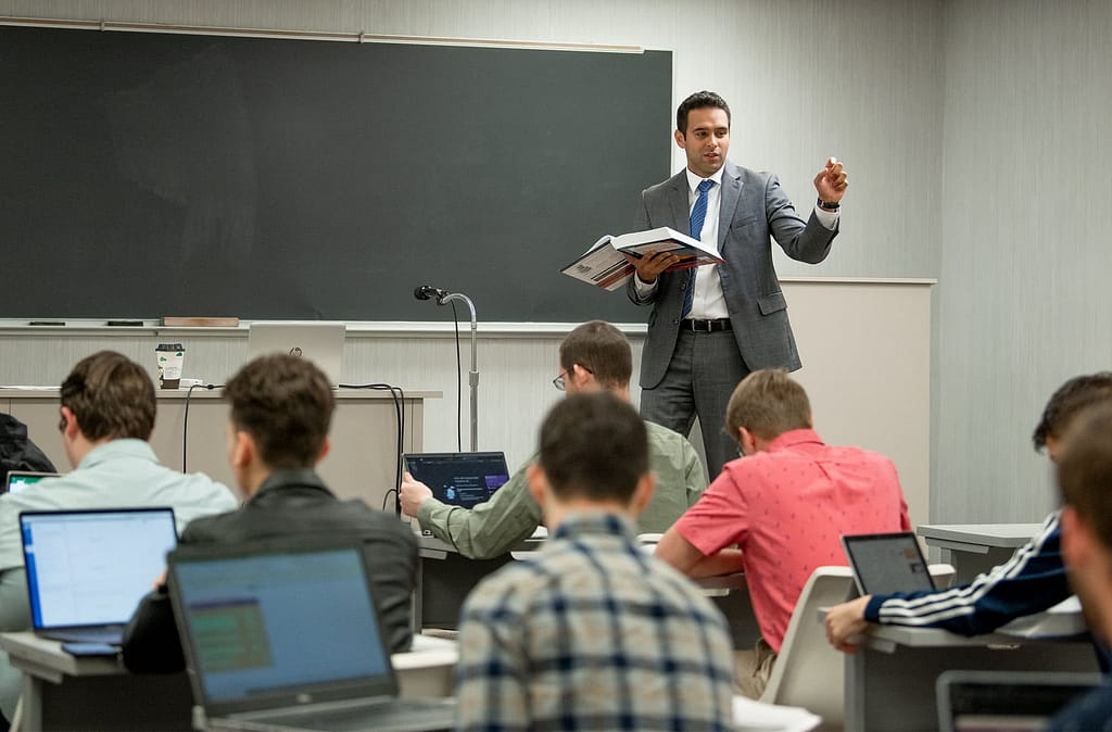 Alex Oliveira teaching in front of a class of PCC students.