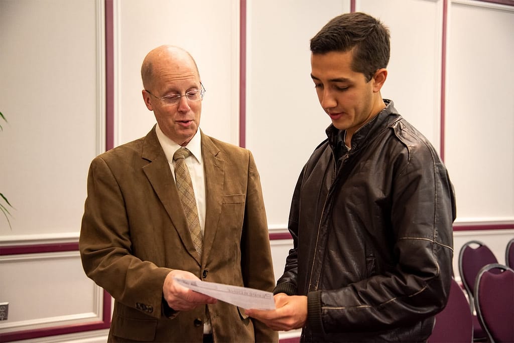 Dr. Bucy talks to a student about the mission field