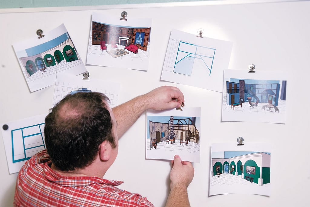Matt Phillips arranging Sketch-Up designs of the Scarlet Pimpernel set.