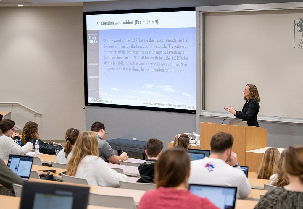 Dr. Watson teaching in class