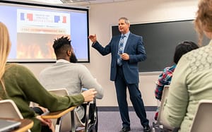 John Reese teaching.