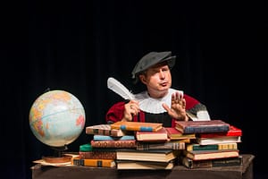 John Reese acts in a history seminar.