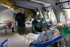 Shannon Wood treating a patient in Italy.
