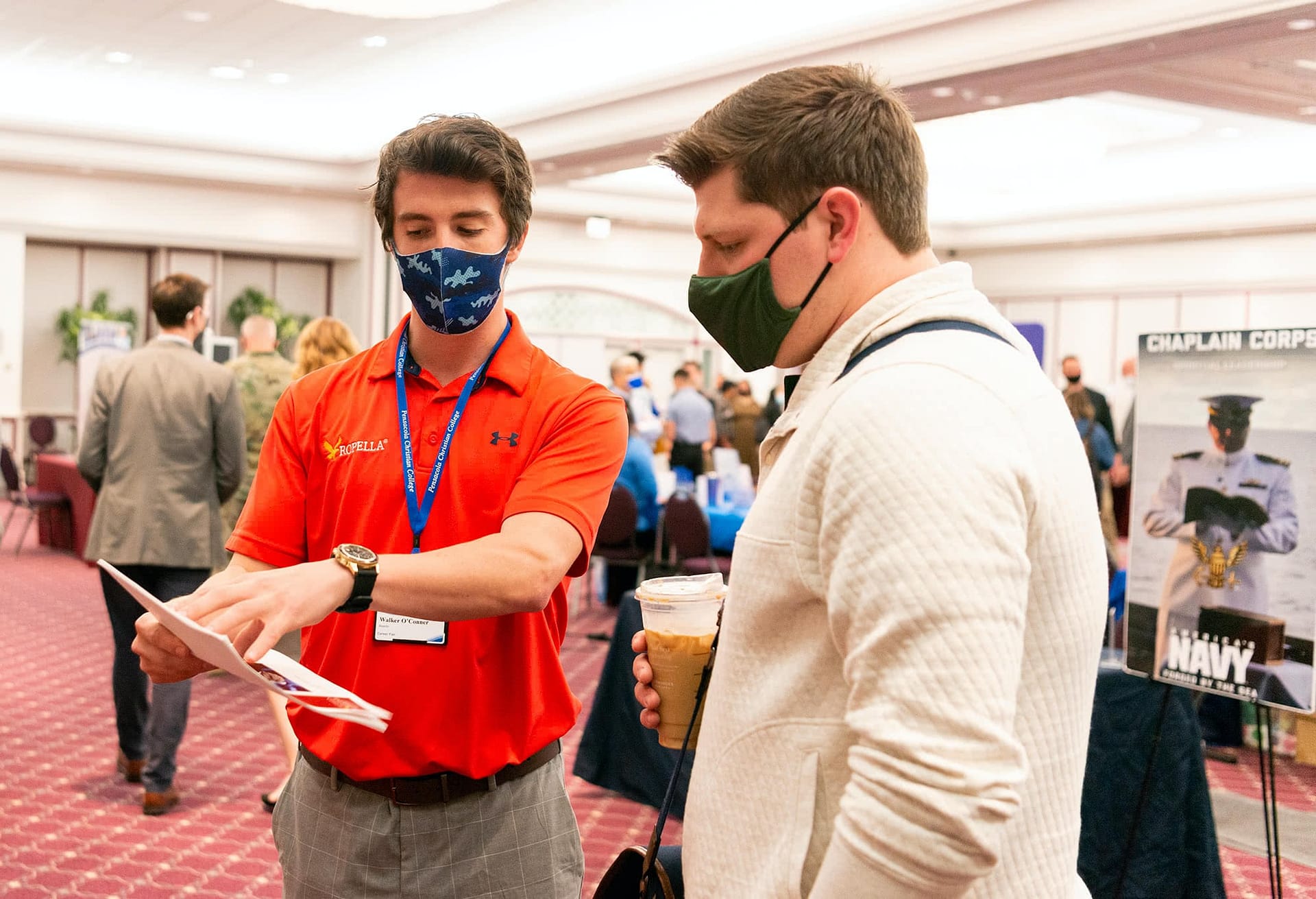 Male student meets with recruiter