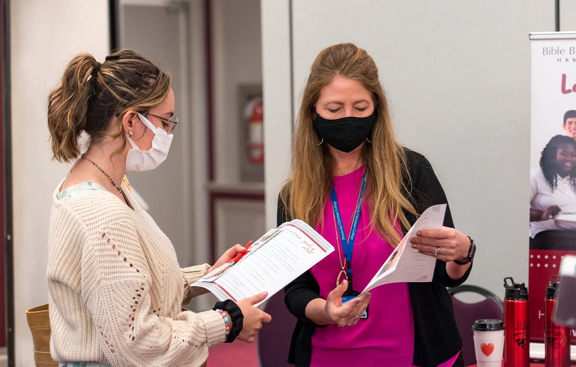 Female student meets with recruiter