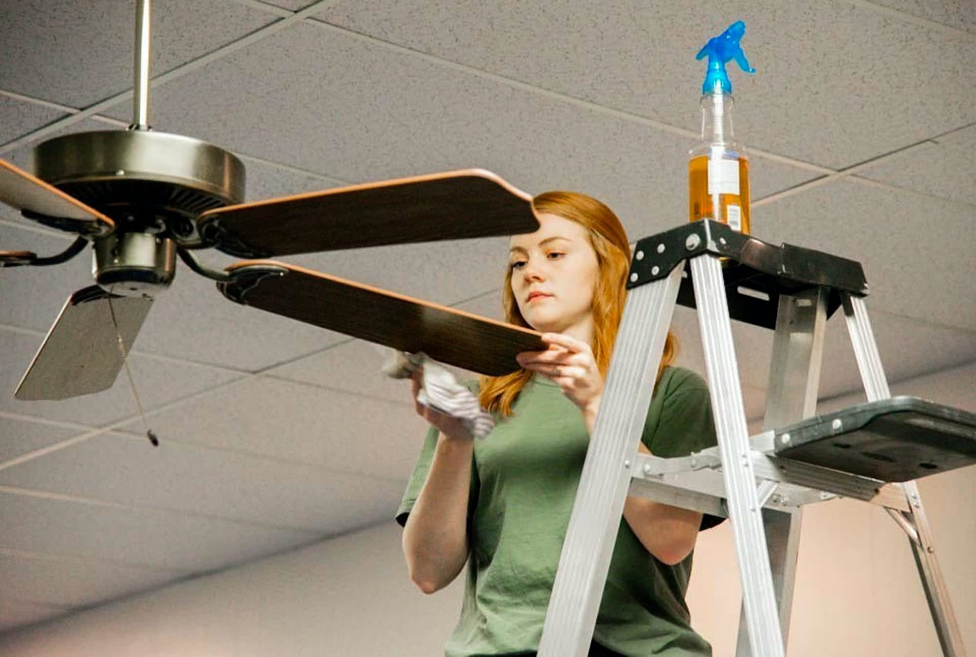 Stormy Helms cleans ceiling fans during serve pensacola