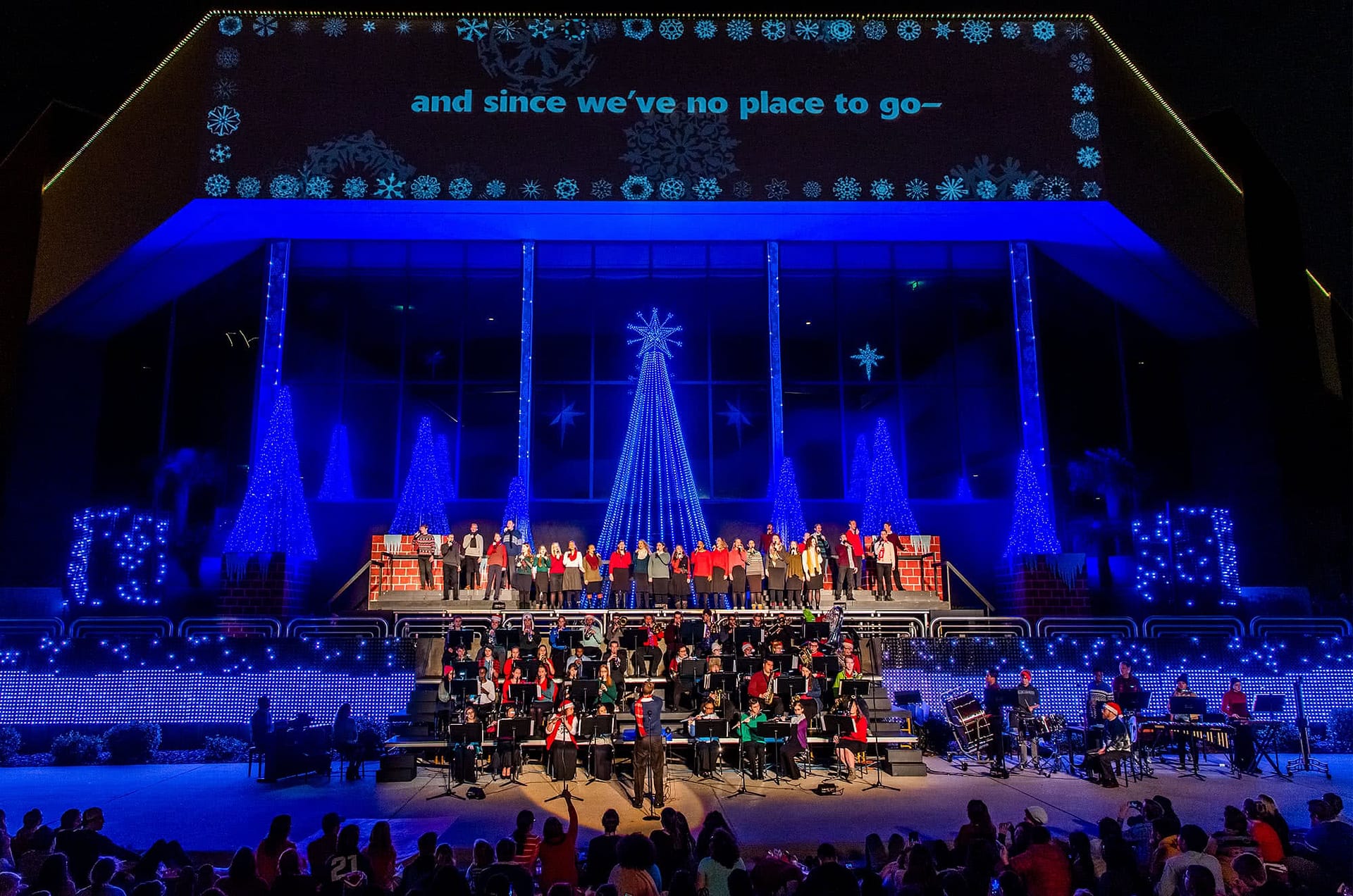 Spirit Singers and Symphonic band perform outside the Dale Horton Auditorium for the Christmas Lights Celebration