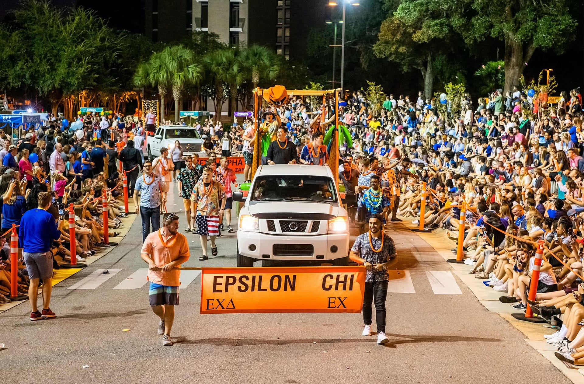 Students, faculty, and staff line Main Drive for the collegian parade