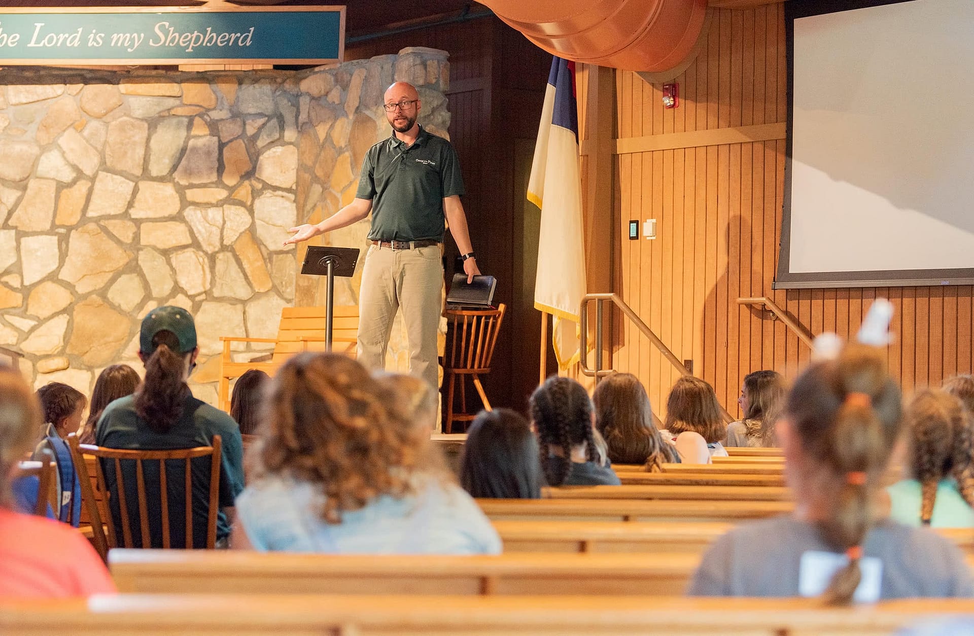 Camp o' the Pines campers listening to preaching. 
