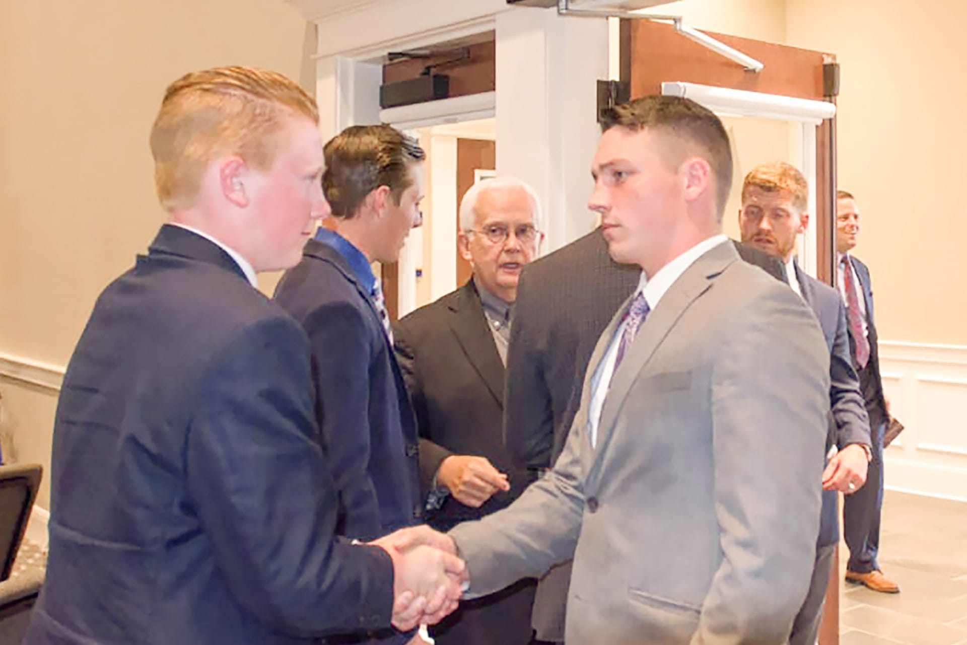 Men shaking hands.