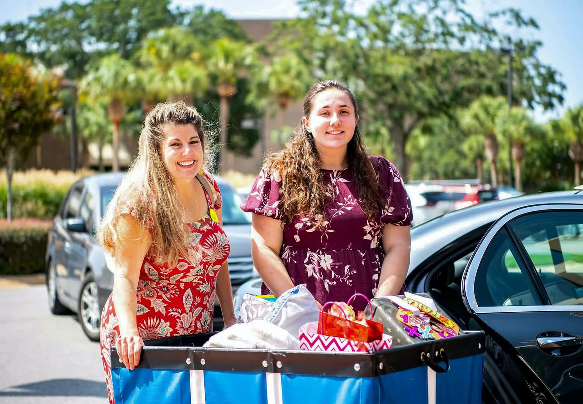 Student with her mother as she moves into the girls dorm for a new semester.