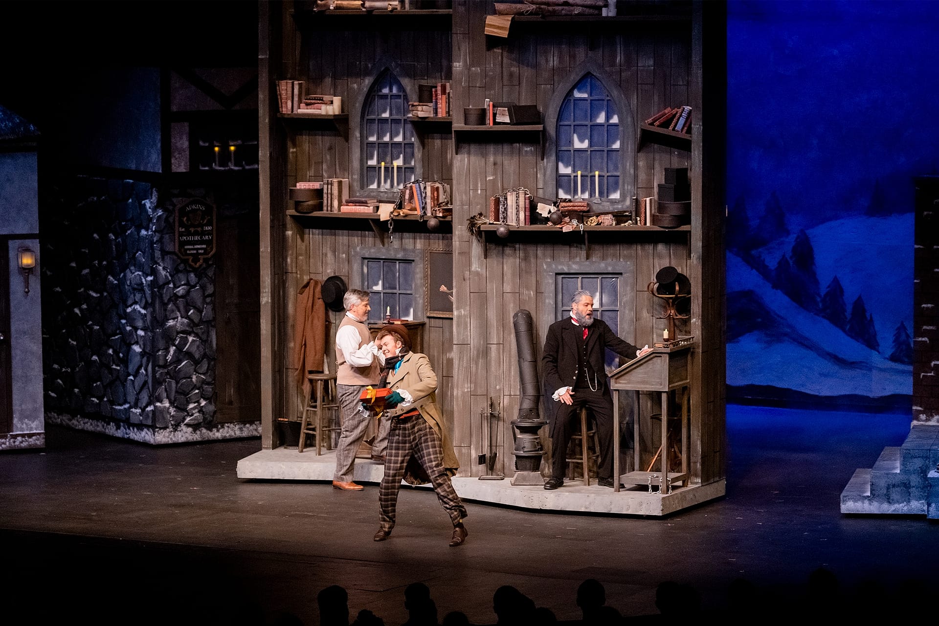 Mr. Scrooge and Bob Cratchit in the office.