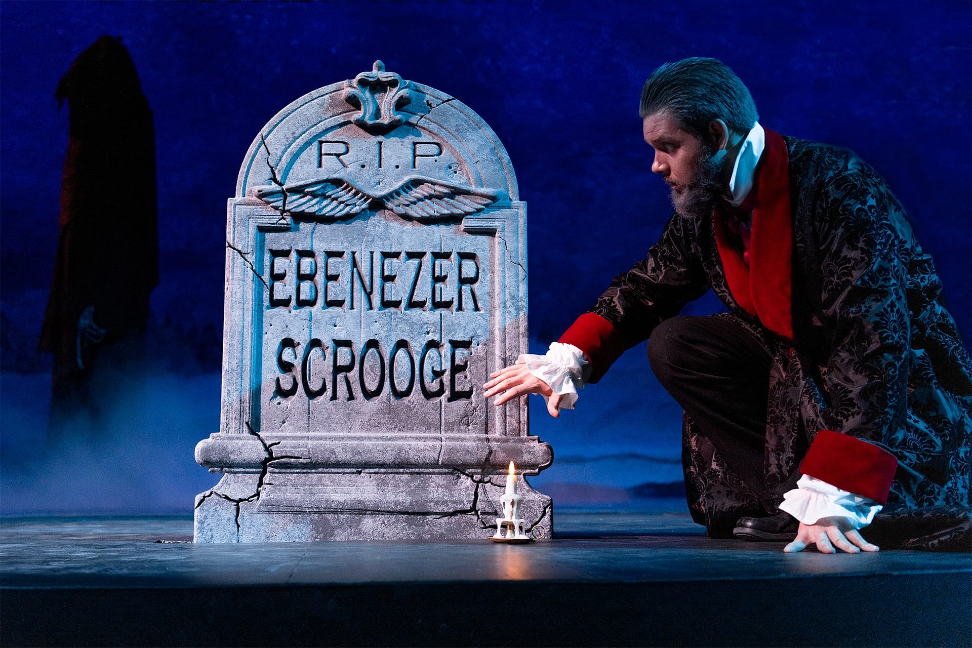 Mr. Scrooge finds his own tomb in his meeting with the ghost of Christmas future.