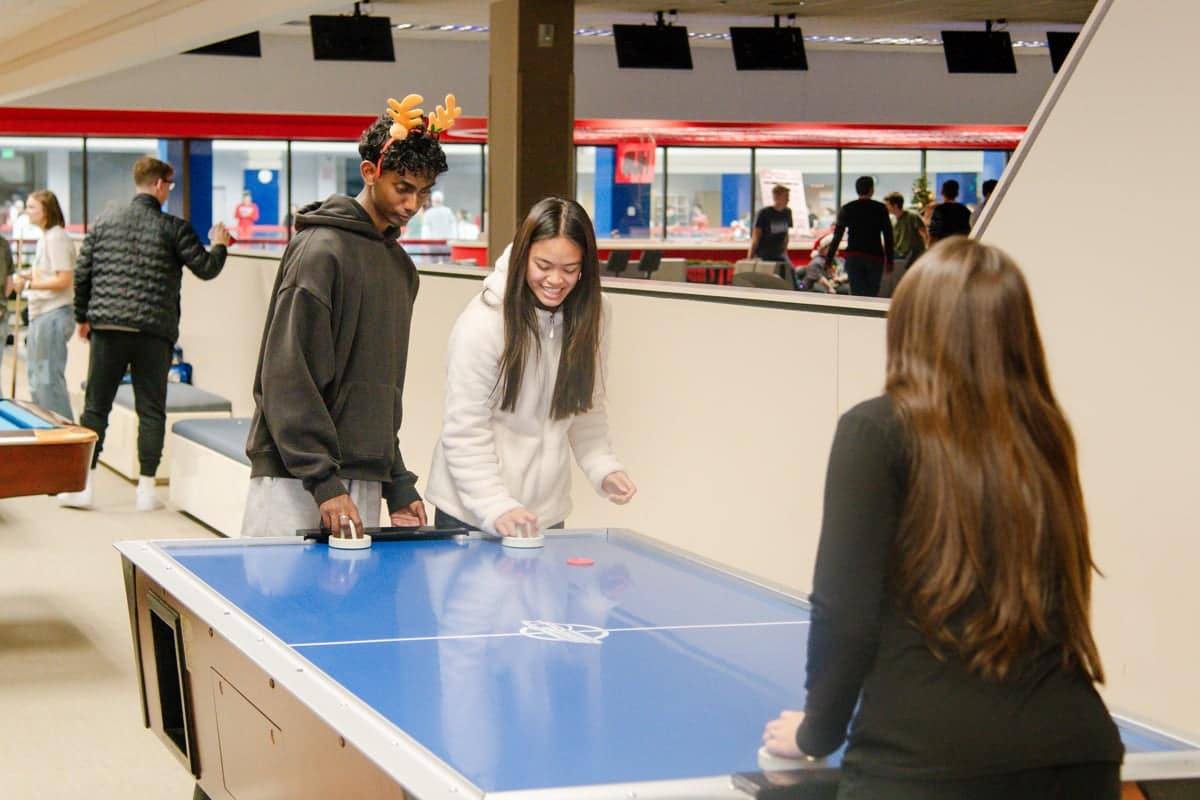 jr-party-airhockey PCC Students play air hockey in the Sports Center at their Junior Party