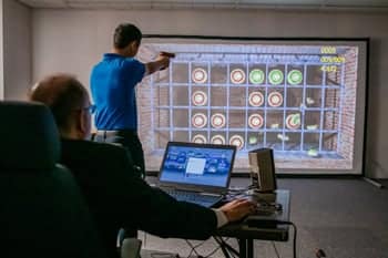 PCC Student practices shooting a target in a criminal justice class.