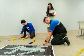 Criminal Justice Students set up a crime scene for practice