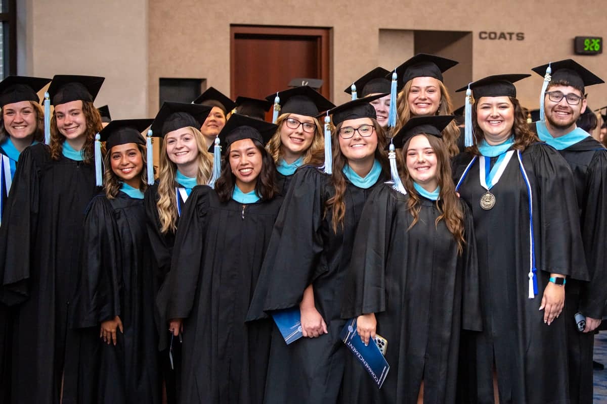Graduates pose for a photo at the PCC Commencement 2025