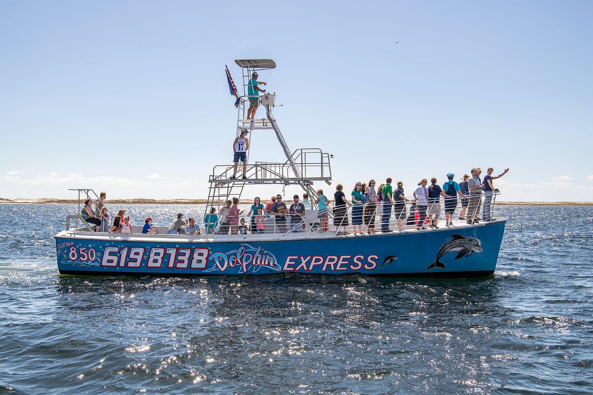 PCC alumni riding on dolphin cruise. 