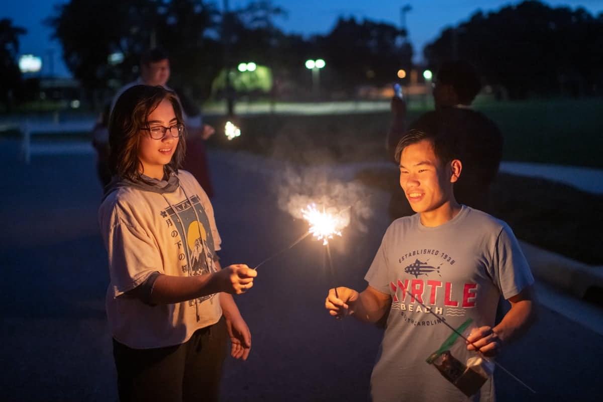 smoresandsparklers-sparklers PCC summer workers enjoy an evening playing with sparklers.