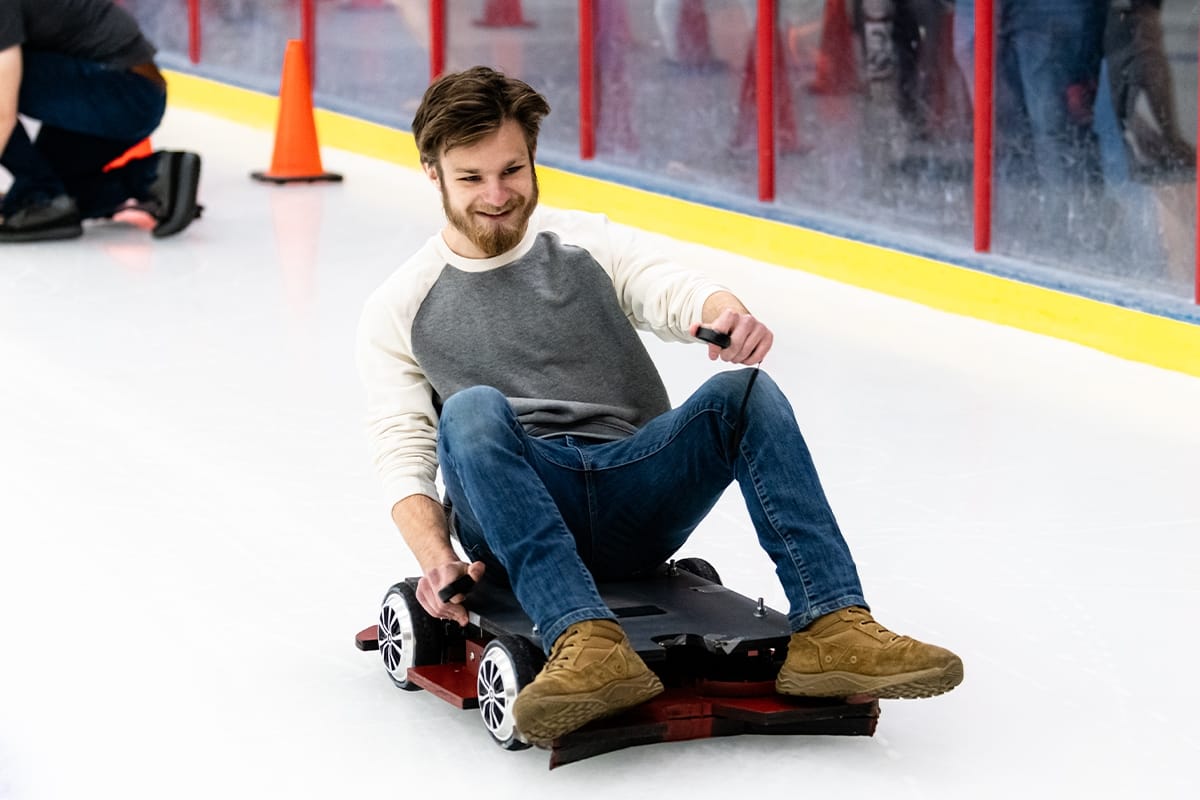 Student rides on robot vehicle during Engineering Design Competition