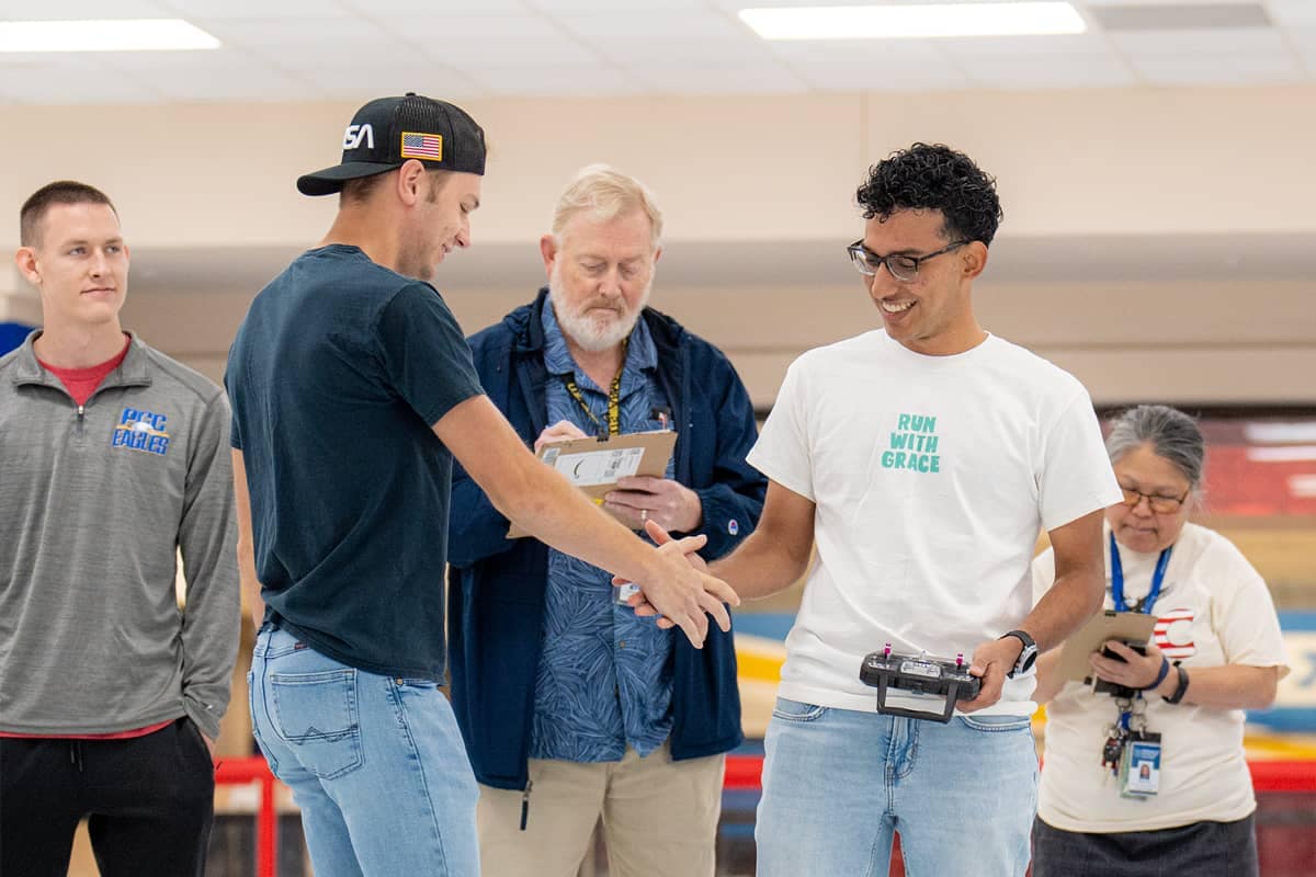 Contestants shaking hands