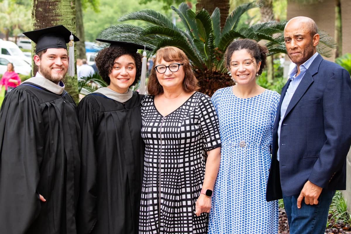 profstud-family 2024 Graduates and their family pose for a photo after Commencement