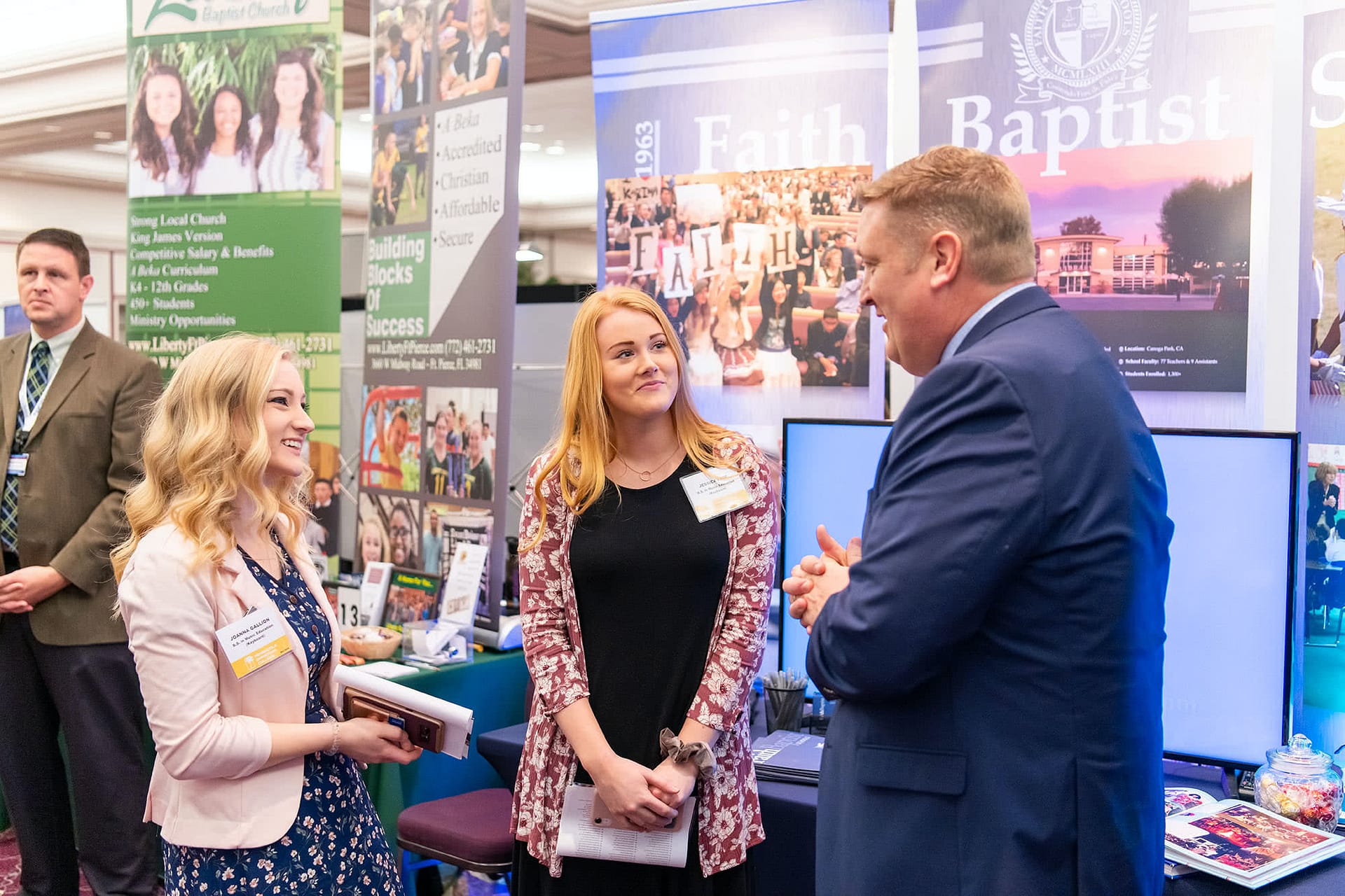 PCC seniors speaking to a christian school administrator at the 2020 Educator Recruitment. 