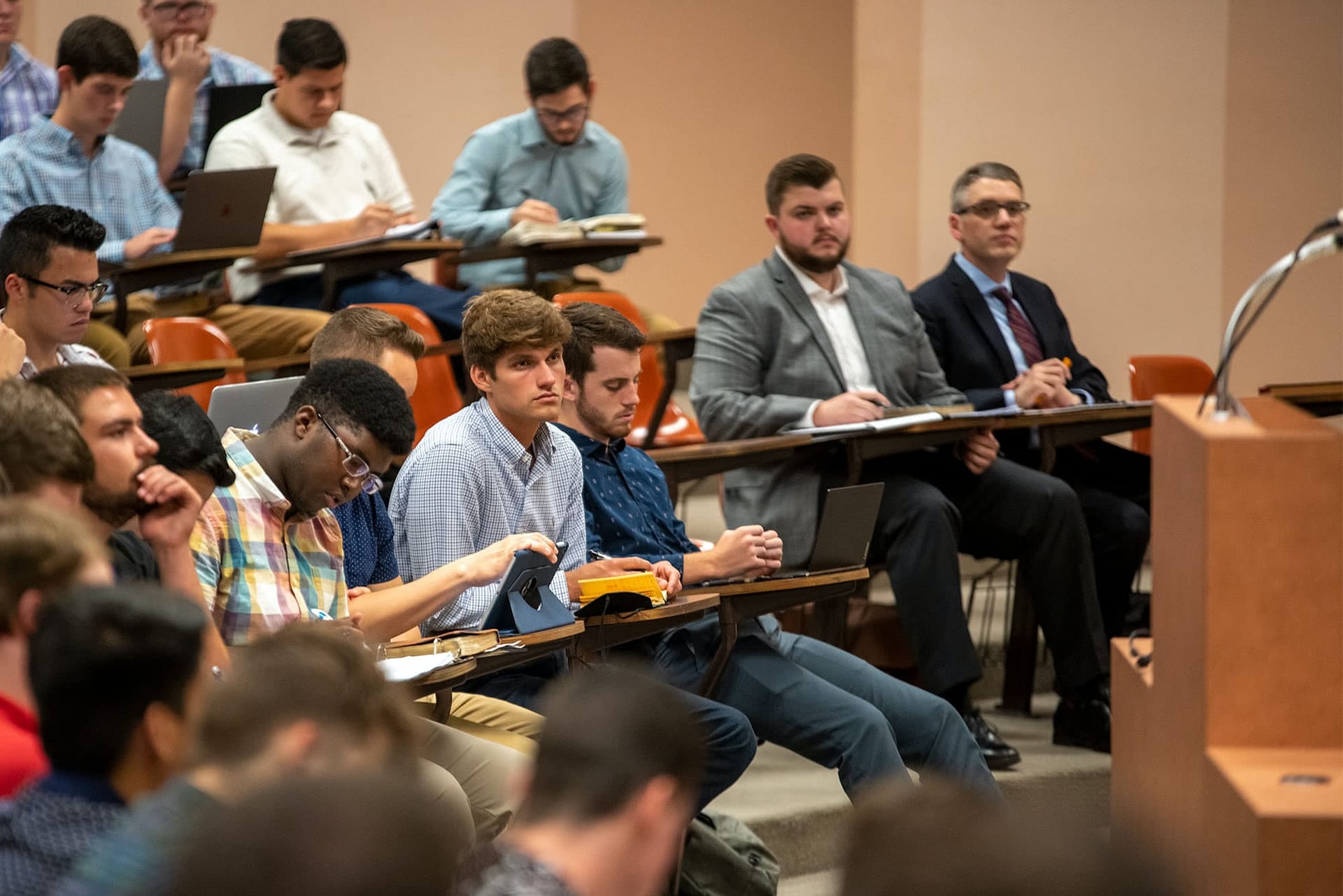 Students listen and take notes during the class
