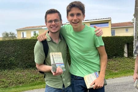 Spain Missions teams guys handing out tracks.