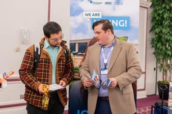 PCC Student talks with a Answers in Genesis Representative at the Career Fair