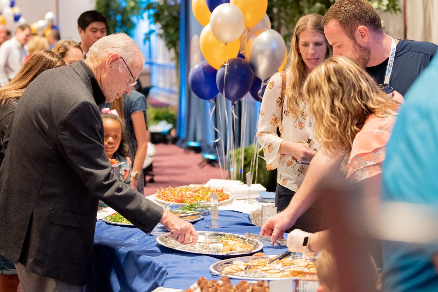 alumni-kickoff-3 Alumni enjoy the refreshments provided at the Alumni Homecoming Kick Off
