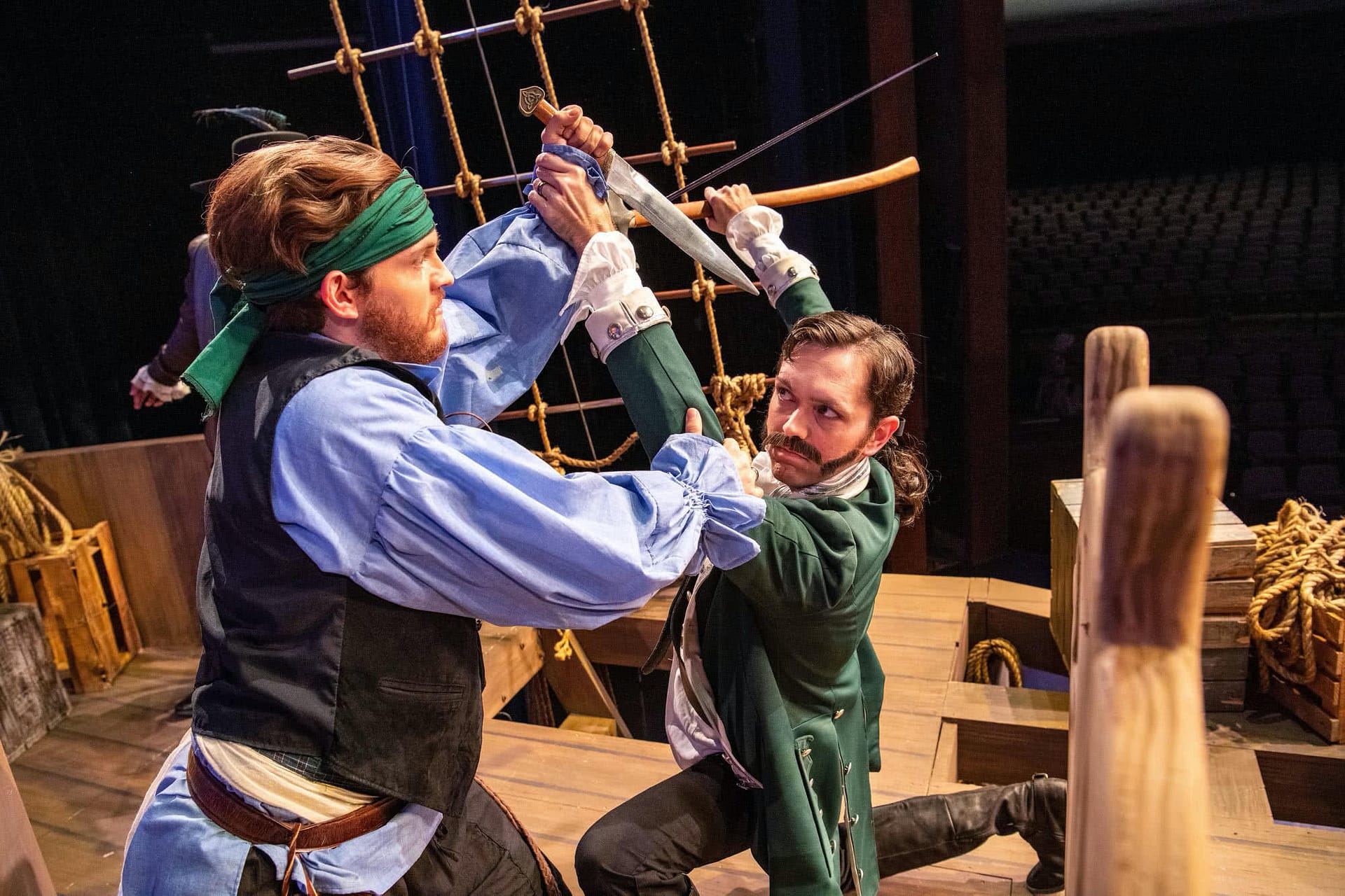 One man sword fights with a pirate in PCC's Treasure Island.