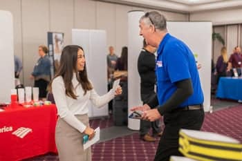 PCC Student talks with a representative at the PCC Career Fair.