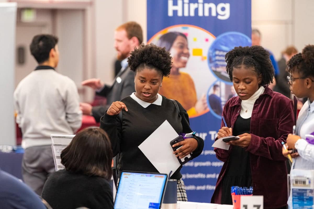 PCC Students visit an Employer representative booth at the PCC Career Fair.