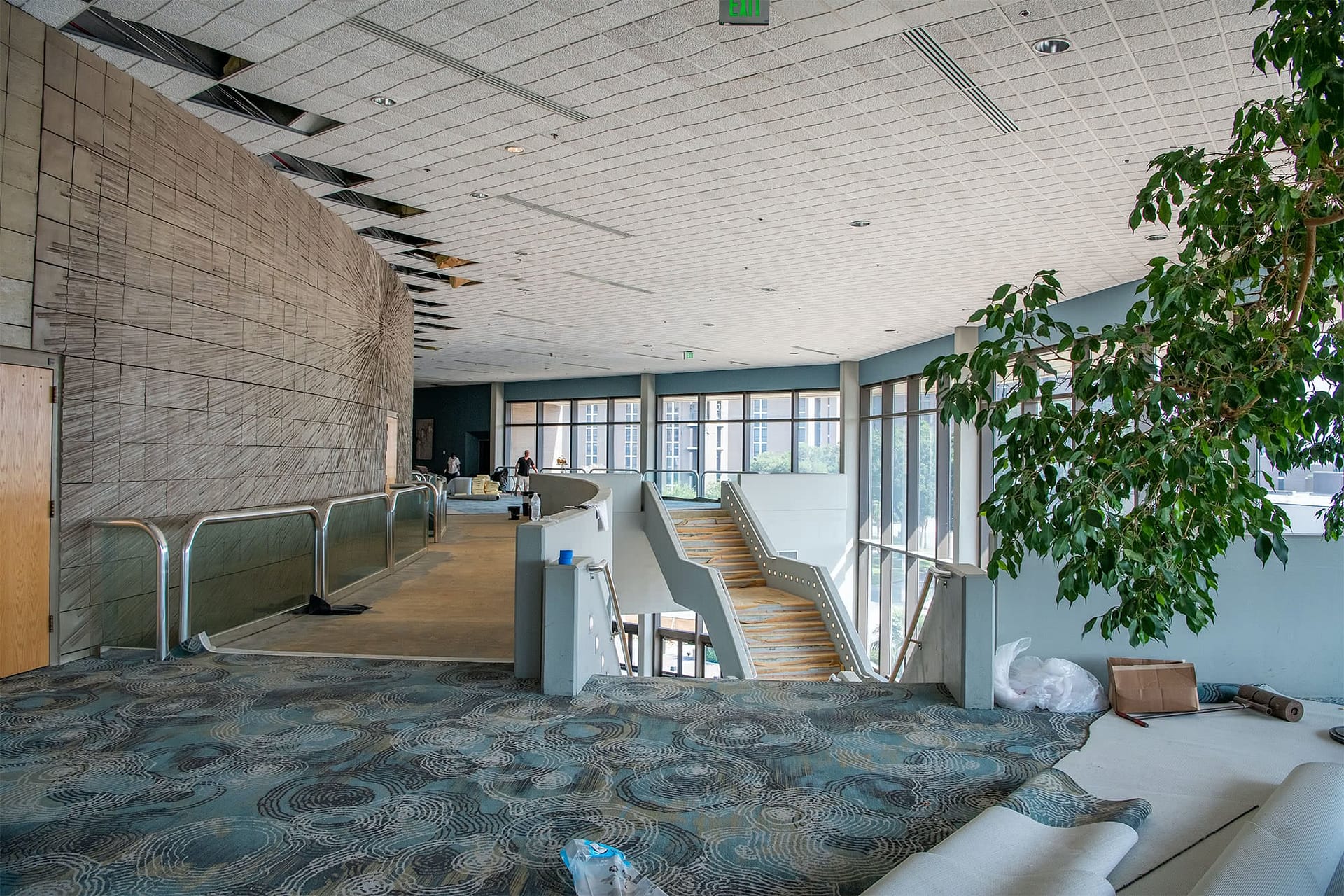 Dale Horton Auditorium 2nd floor and stairs being carpeted during renovation..