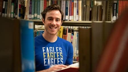 Smiling student in library
