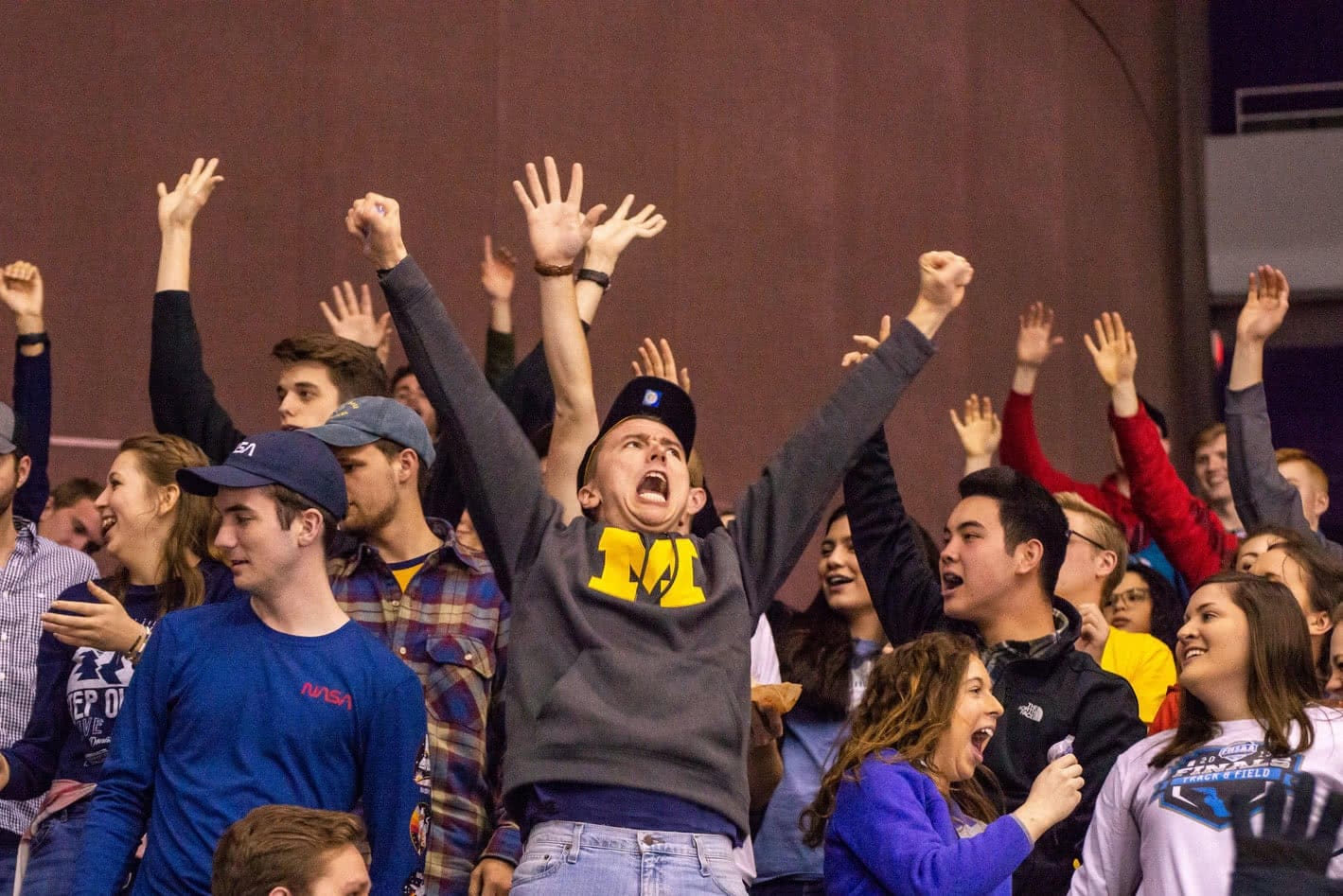 Students cheering during the Ice Flyers hockey game.