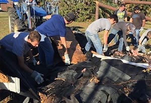 Hurricane relief workers clearing debris.