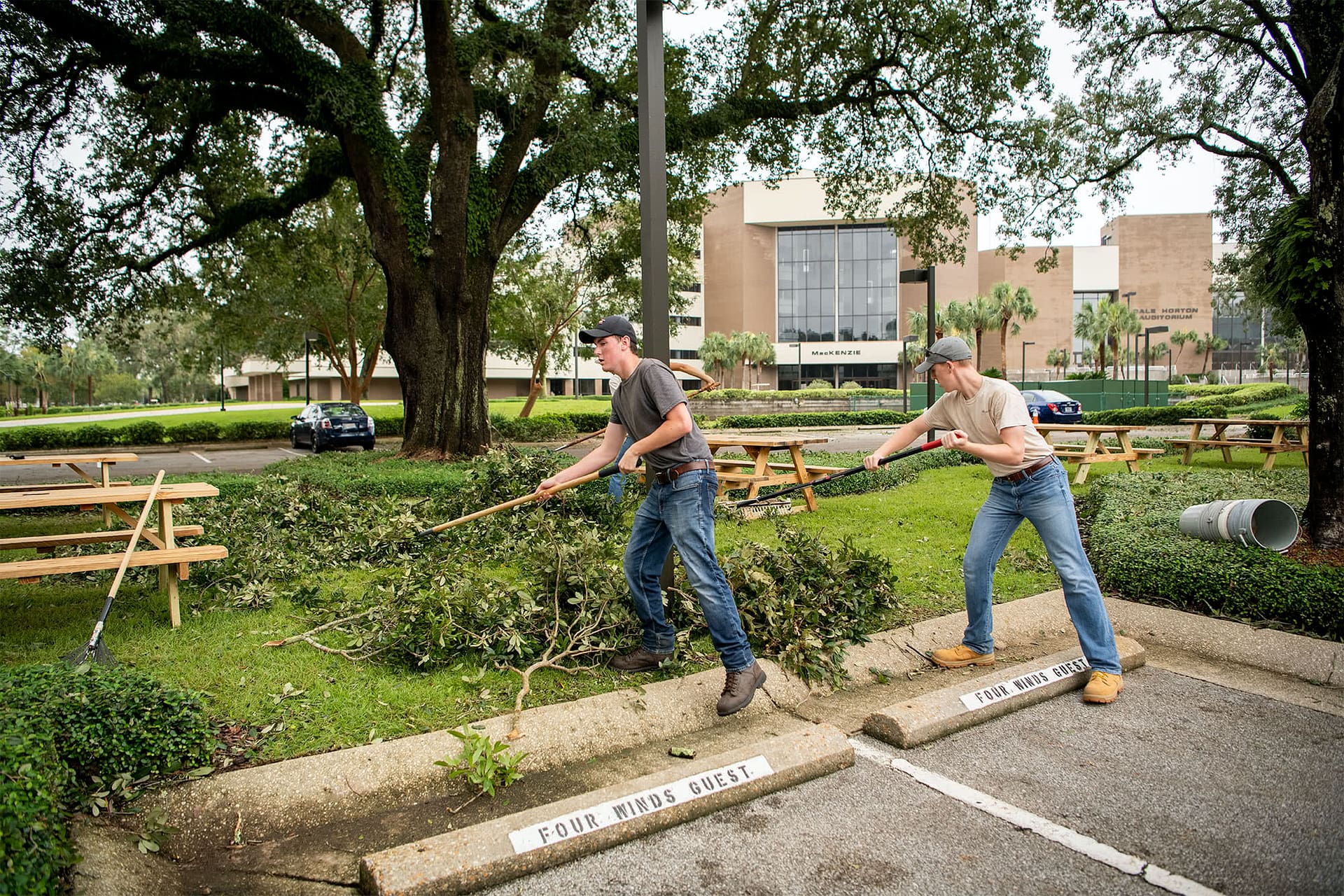 Students clean up outside the Four winds