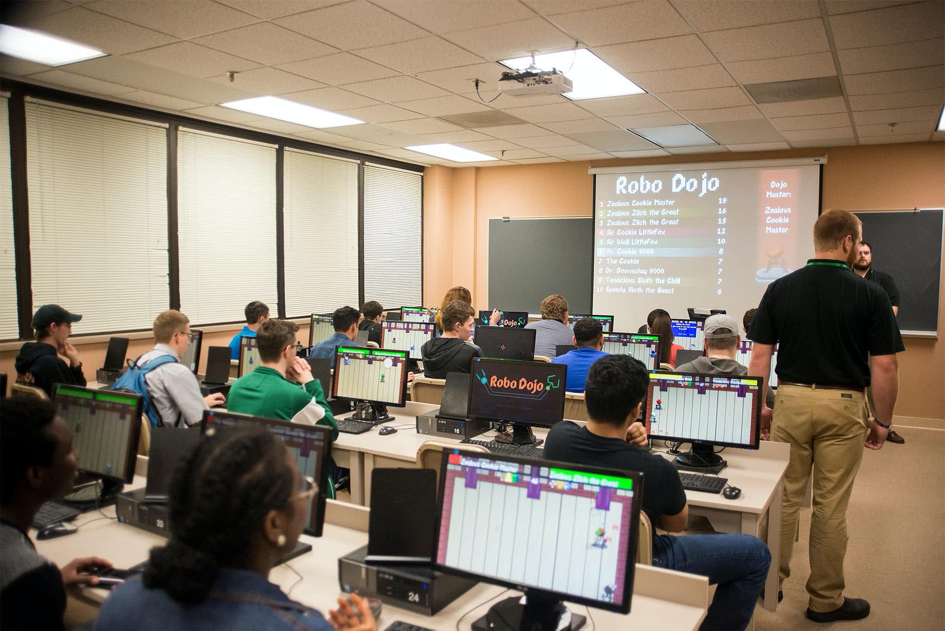 Students playing a student-created computer game during the Software Expo. 