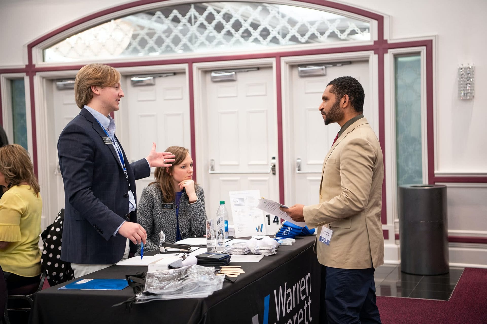 PCC senior speaking at a booth with a business representative at the 2020 Career Fair. 