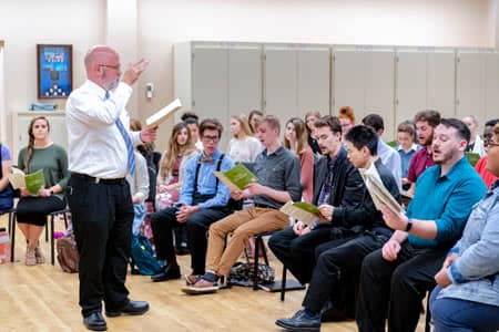 Faculty Tim Willingham leading choir