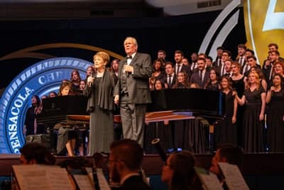 Drs. Ray and Ann Gibbs singing during the Gala.