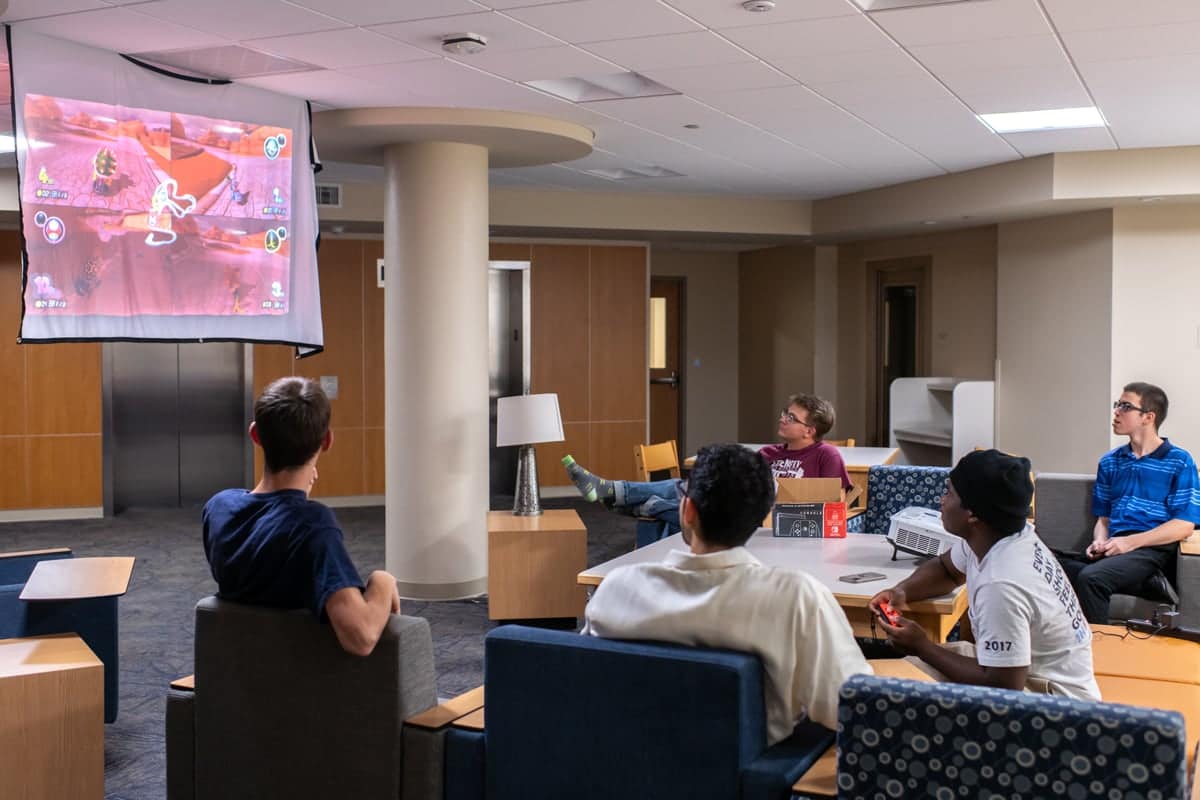 summer-residencehall-videogames PCC Summer workers play video games in their residence hall