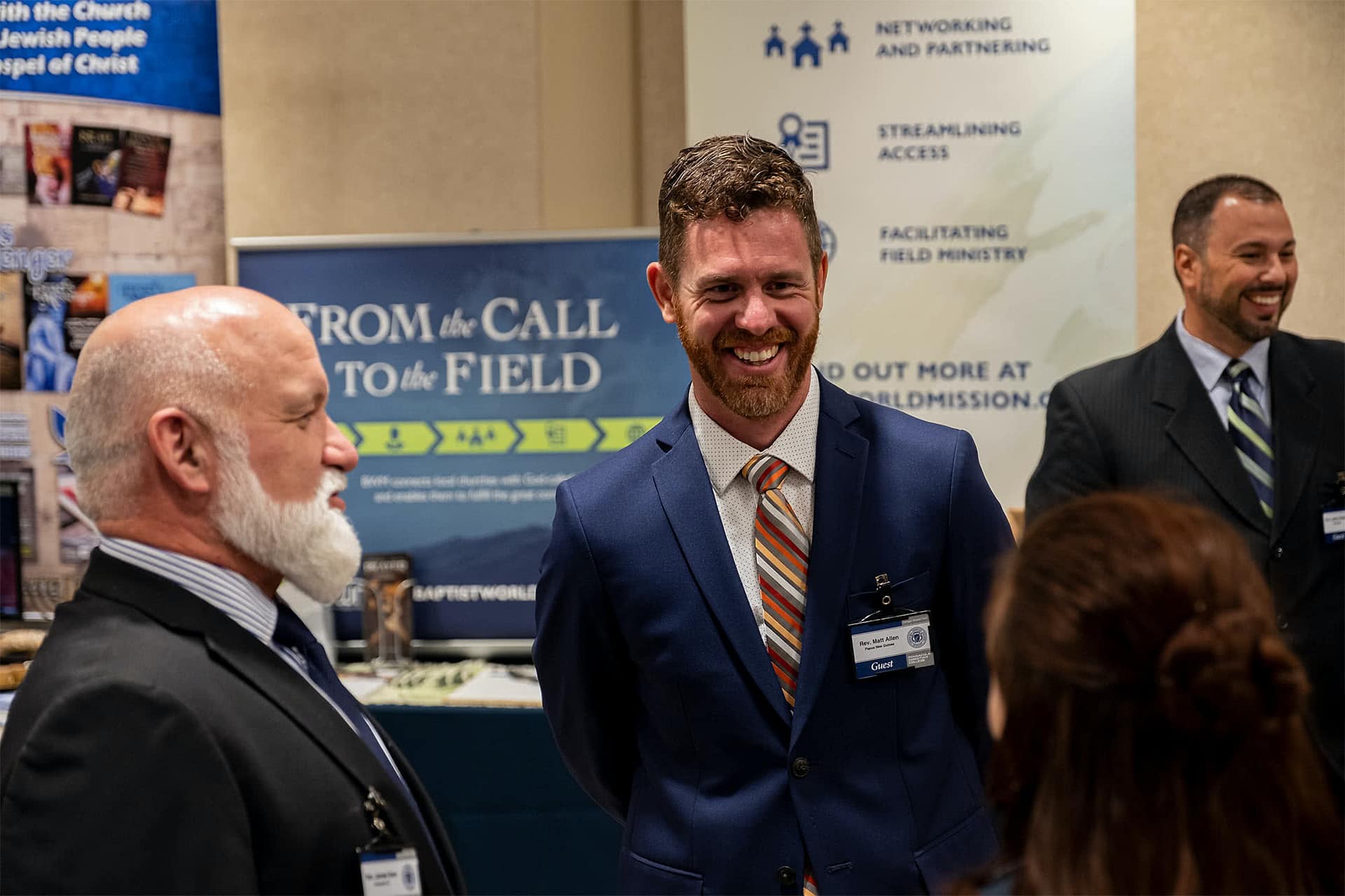 Missionaries speaking at booths during Missions Conference.