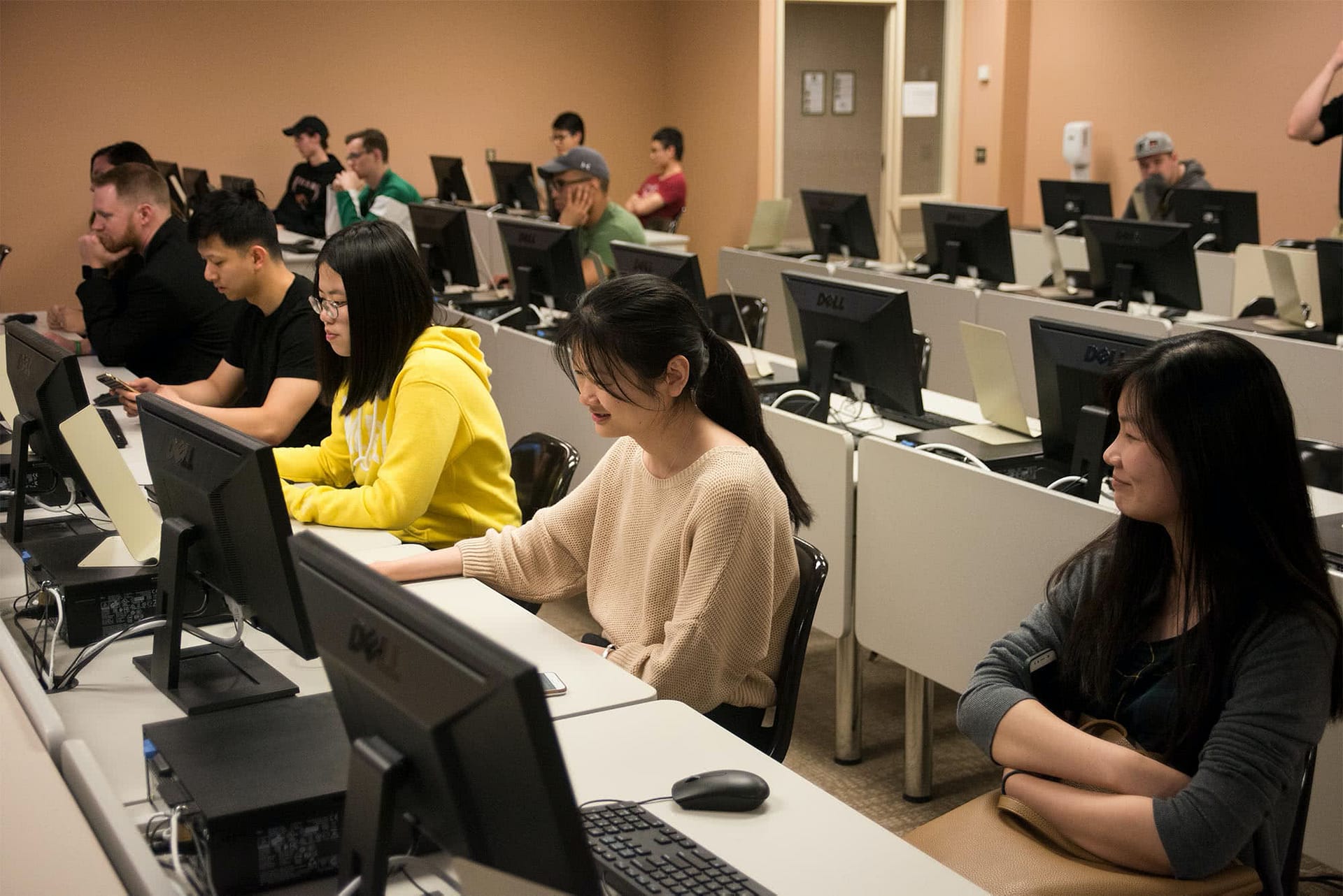 Students sitting at computers during the Software Expo. 