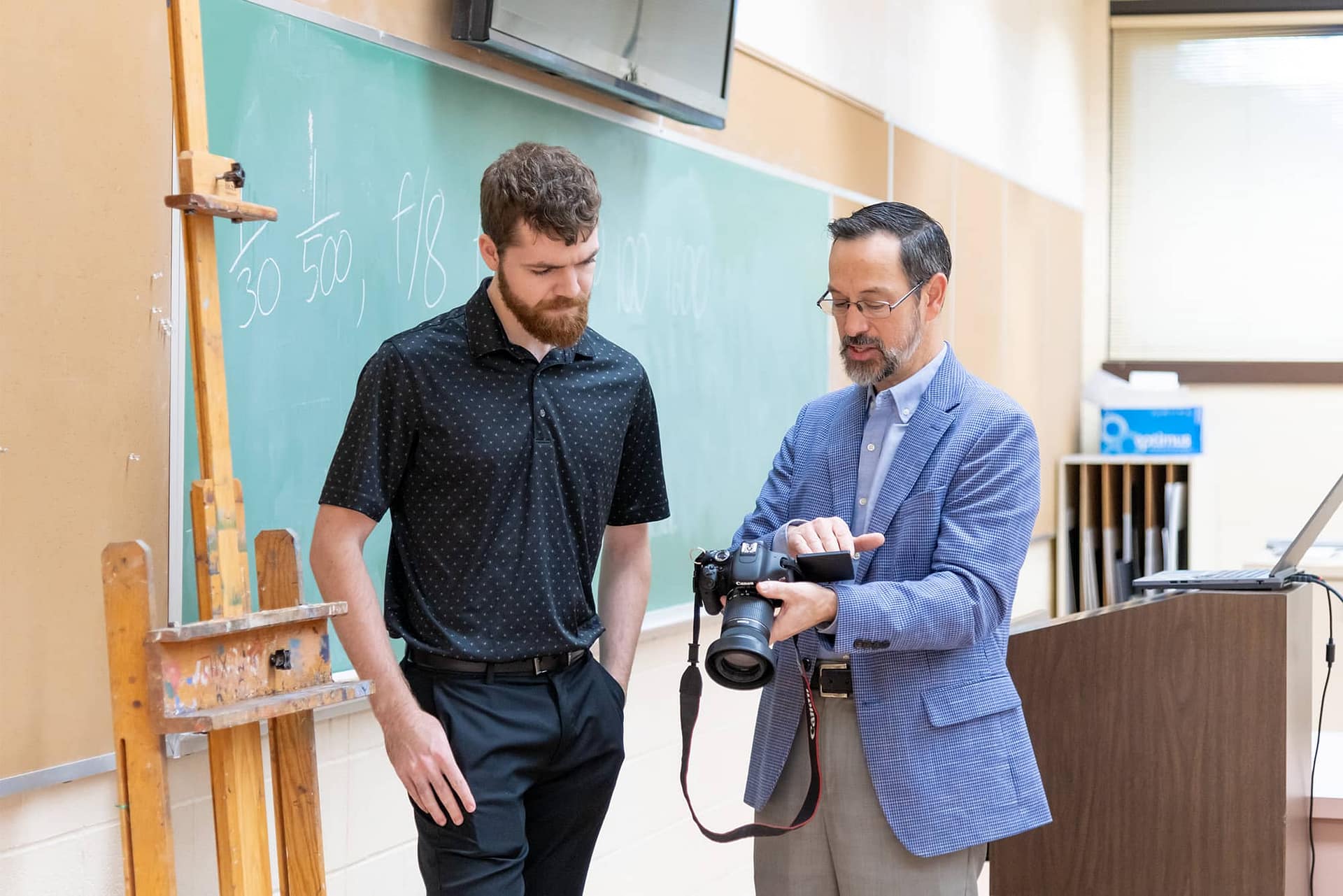 Slideshow-8 Teacher instructing student with camera
