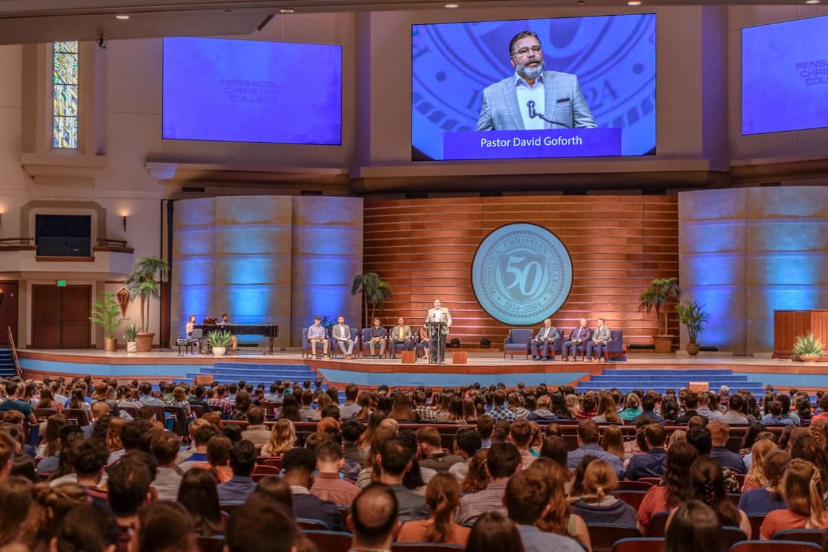 Pastor David Goforth speaks at the Legacy Bible Conference Prayer and Praise service.